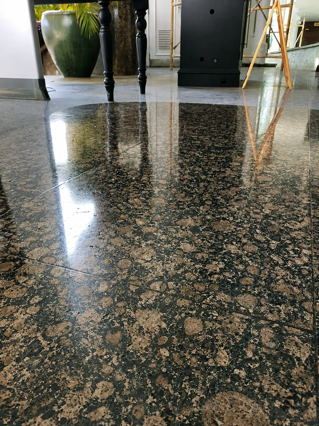 Patterned brown granite floor polished to a mirror finish