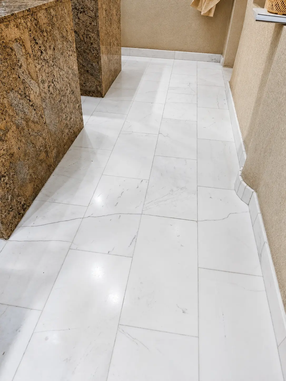 Bright white marble corridor with clean joints and an even finish