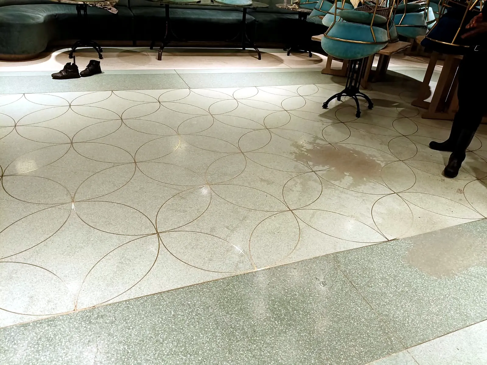 Decorative terrazzo hospitality floor with circular linework after polishing